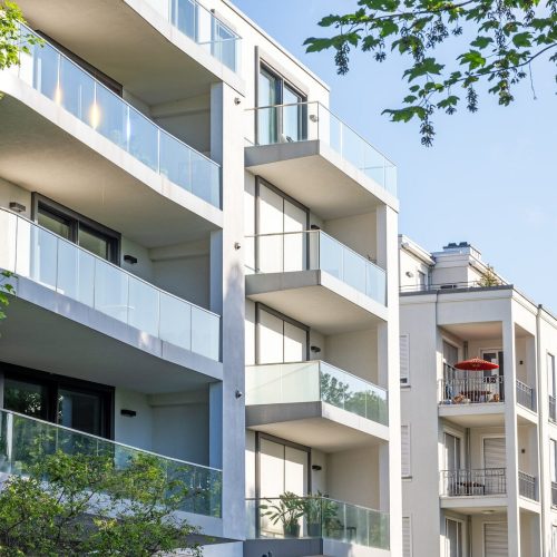 modern-apartment-buildings-surrounded-by-greens-e1752576216506